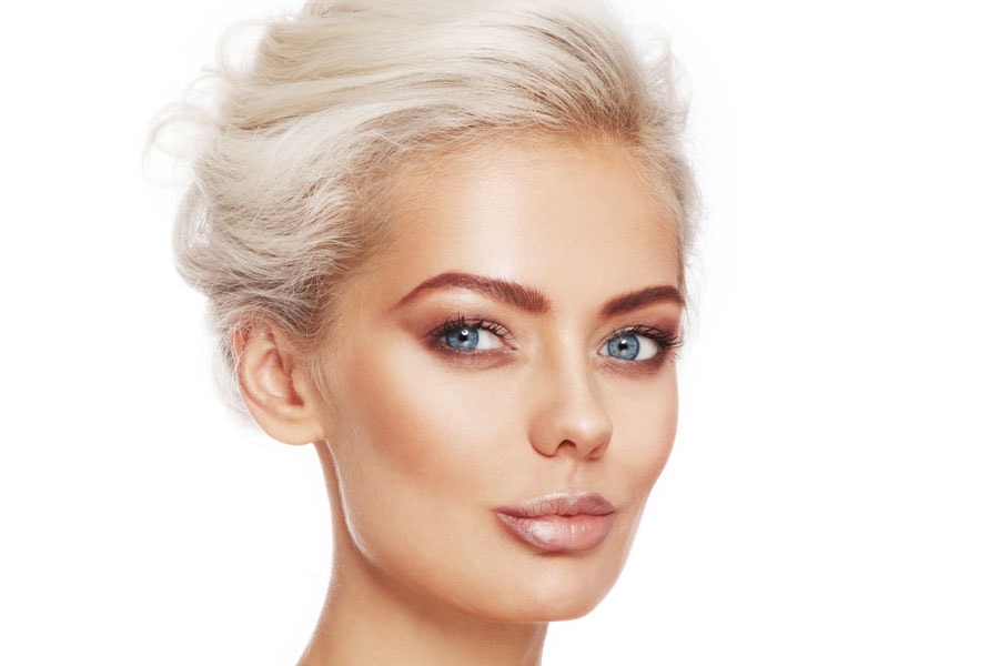 A bronzer or self tanner applied to the face can help your skin glow